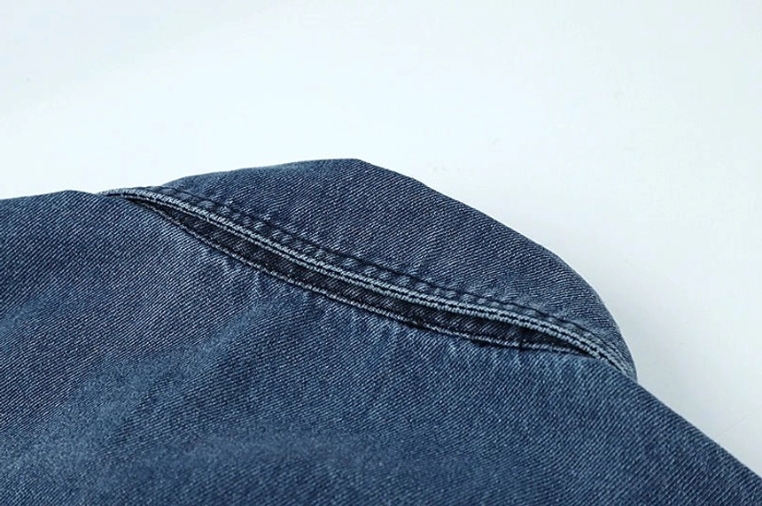 Washed blue denim overshirt for women with a relaxed silhouette, classic collar, button front, and everyday versatility