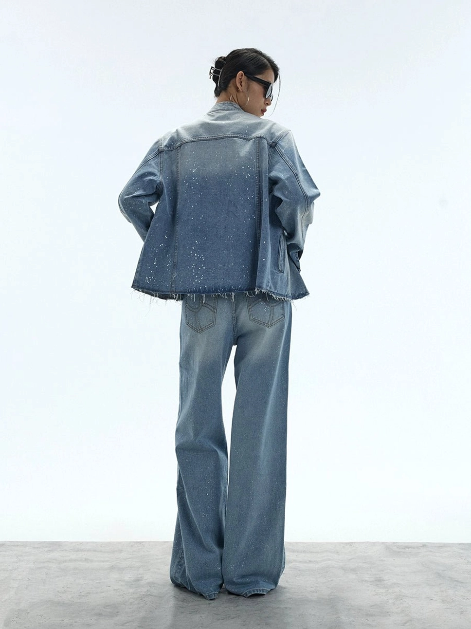 Washed blue stardust glitter wide-leg denim jeans with vintage fading and an exaggerated relaxed leg