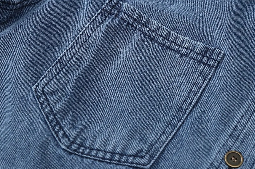 Washed blue women's denim shirt jacket with a medium-length silhouette suitable for autumn layering and casual city looks