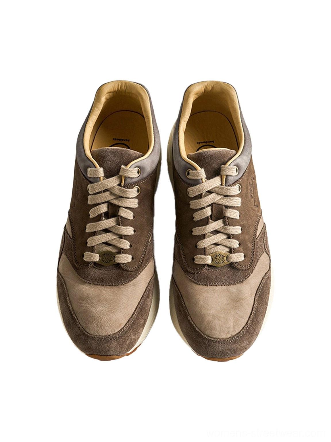 Front display of matching washed brown retro trail runner sneakers with symmetrical vintage runner silhouette