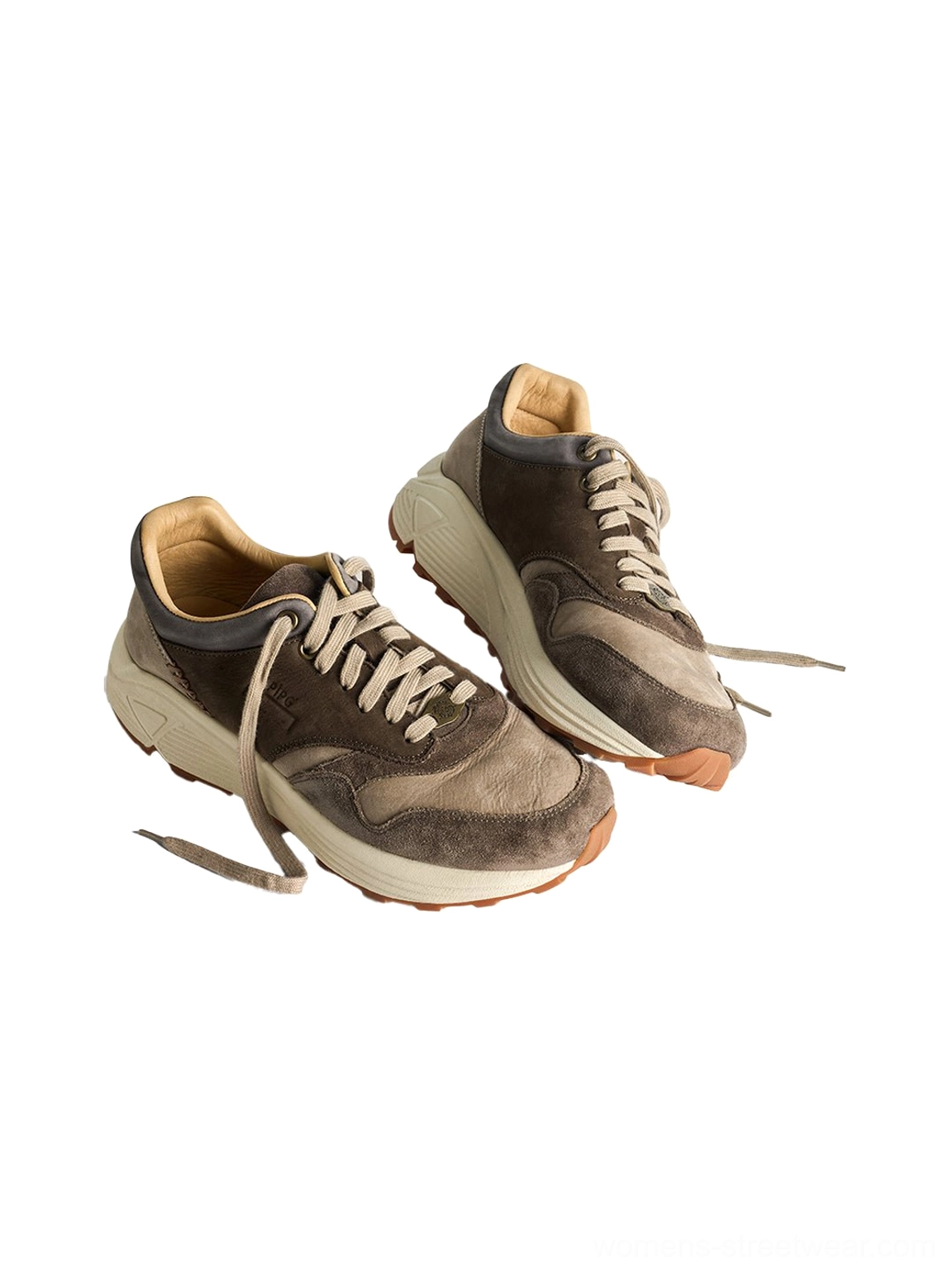 Washed brown retro trail runner sneakers showing vintage suede construction and chunky streetwear outsole