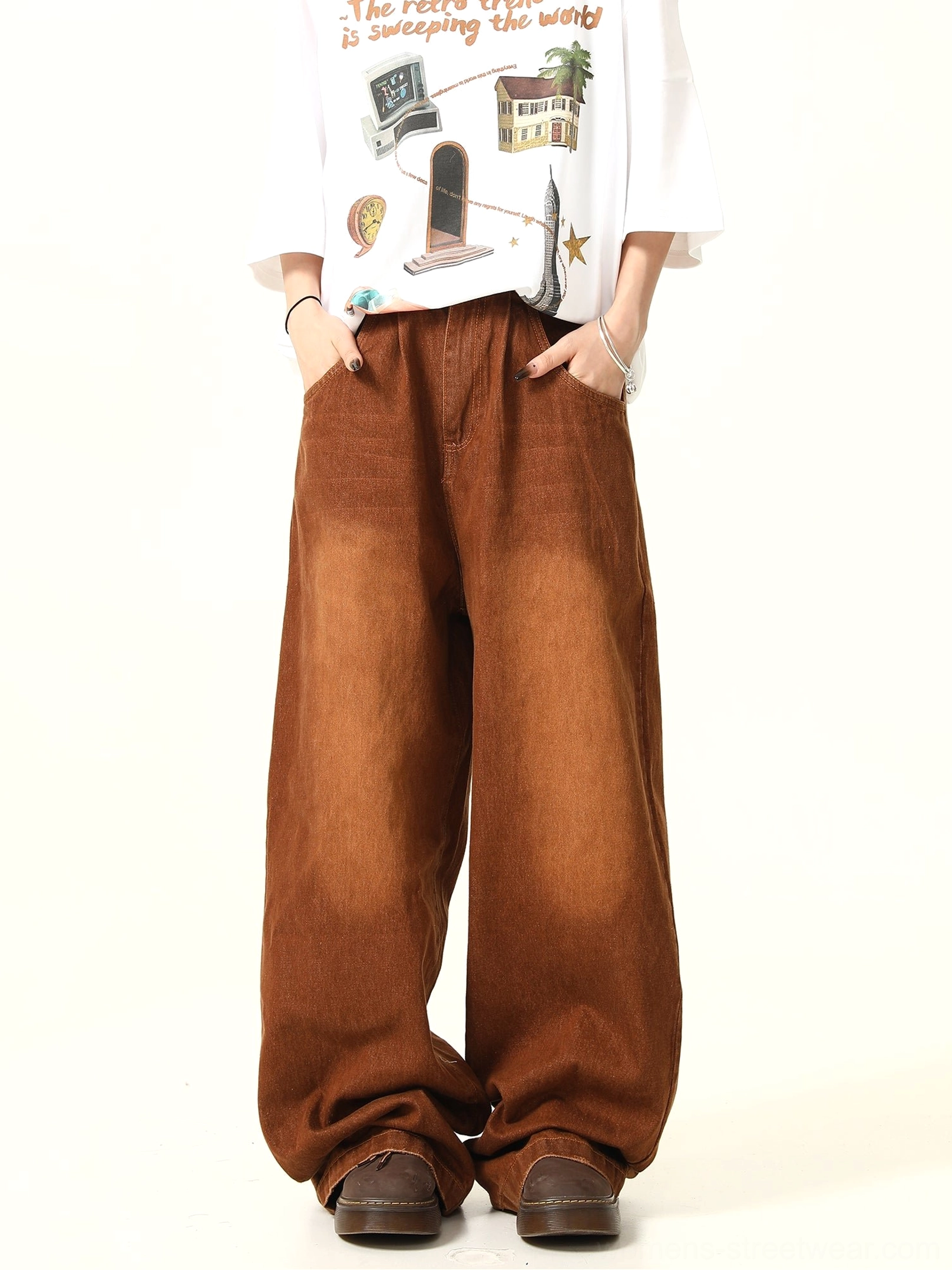 Front full-body view of washed brown vintage streetwear denim pants with a roomy wide leg silhouette