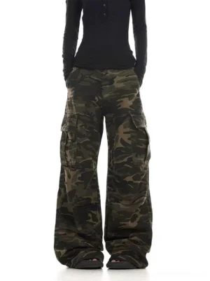 Women’s faded camouflage cargo pants styled with a black long sleeve top in a relaxed wide leg streetwear fit