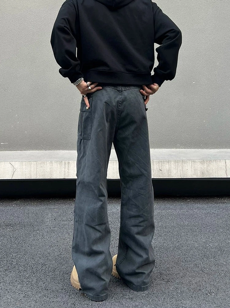 Rear view of washed charcoal gray wide-leg cargo pants with rear cargo pocket, relaxed seat, and faded workwear finish