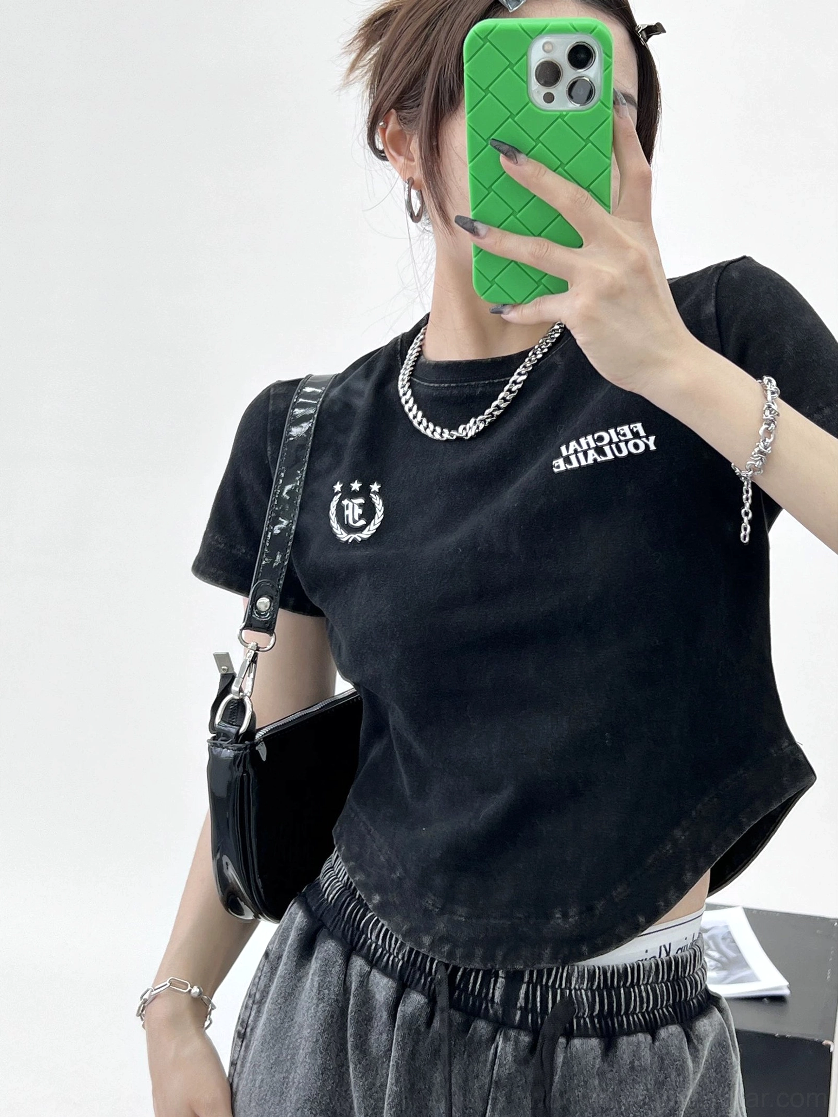 Washed black collegiate logo curved hem streetwear t-shirt mirror selfie outfit view
