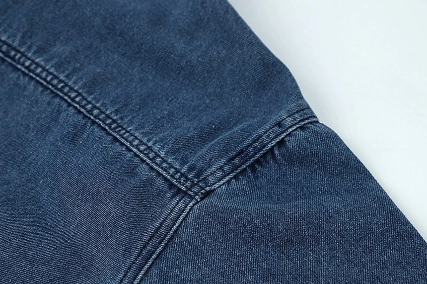 Washed dark blue denim shirt jacket for women styled as a versatile casual outer layer for everyday city wear