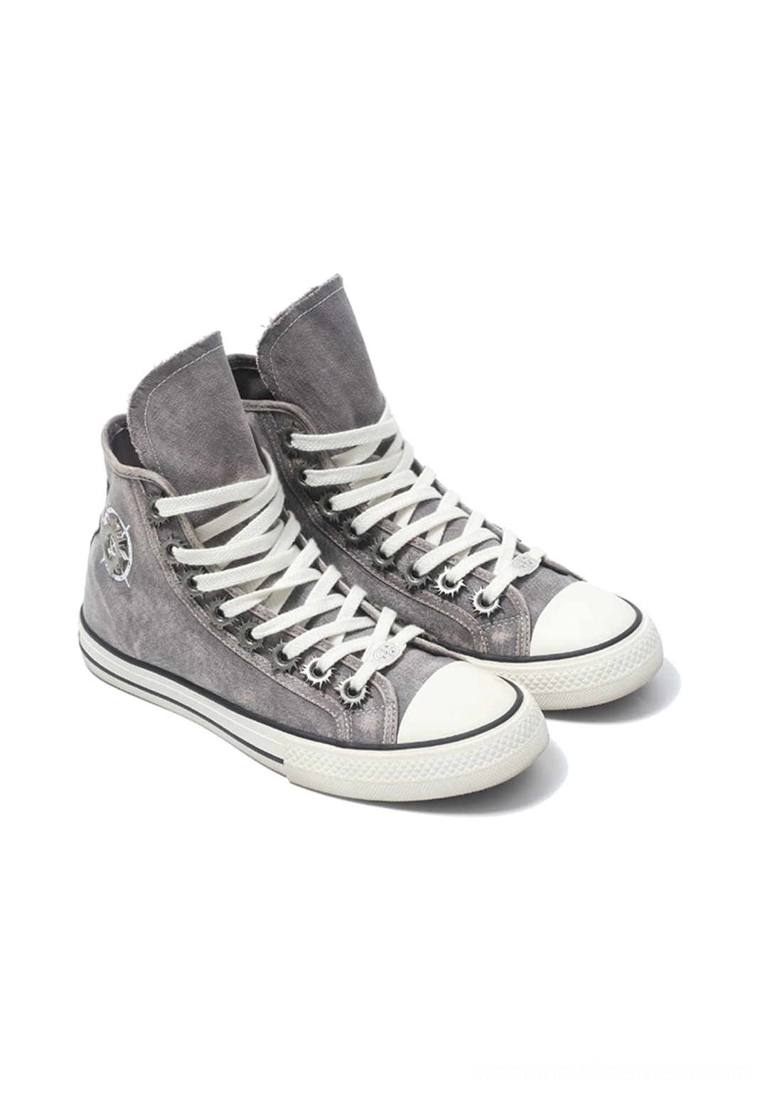 Pair of washed gray distressed high-top denim sneakers with tied white laces frayed ankle collars and rubber toe caps