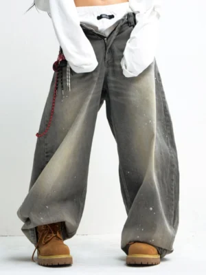 Washed grey wide leg jeans styled with a cropped white top and tan work boots, showing a relaxed low-rise waist and oversized Korean streetwear silhouette