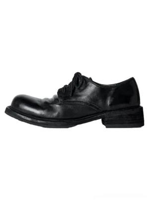 Black washed horsehide round-toe derby shoes side profile with glossy burnished leather upper and low stacked heel