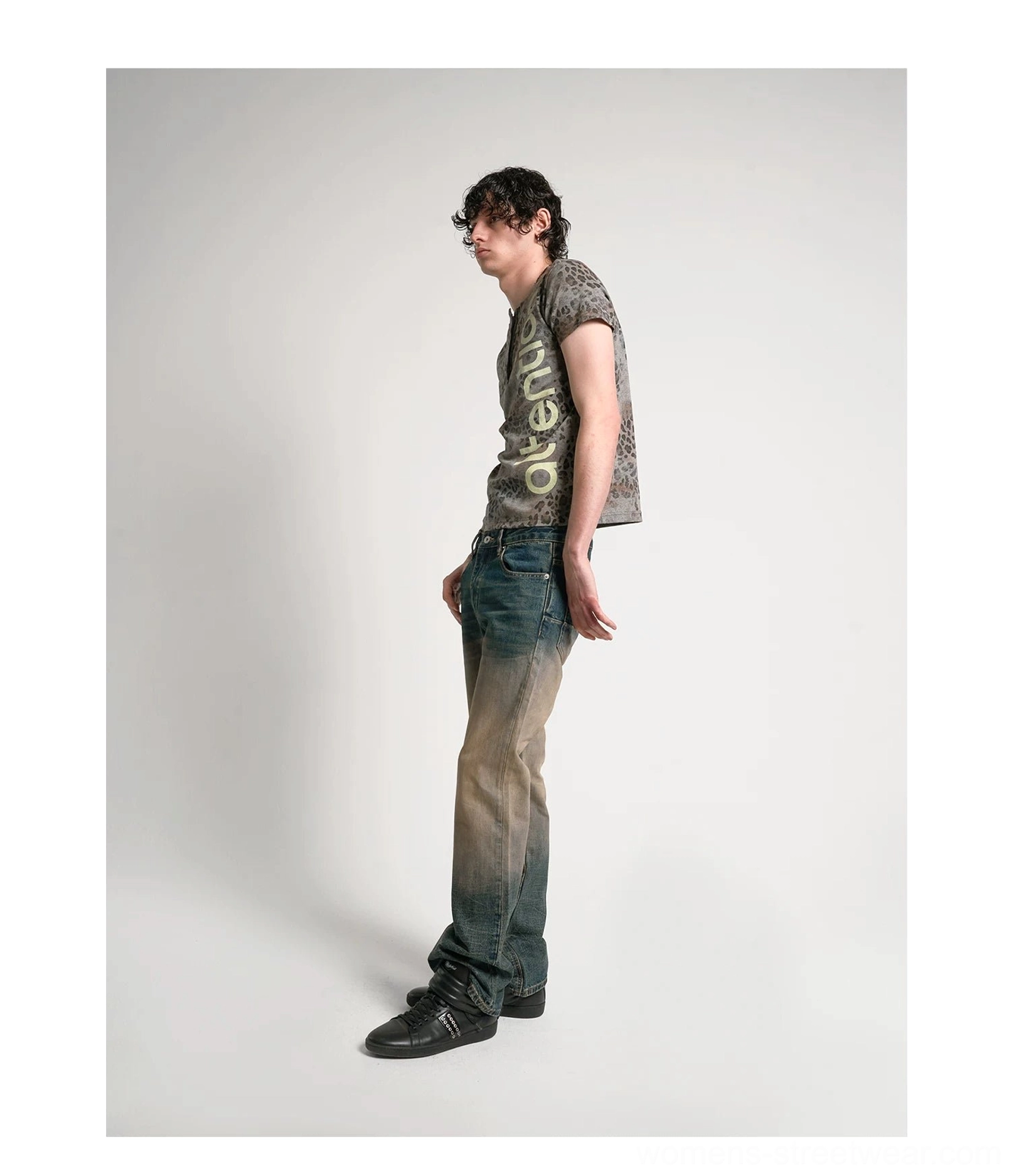 Washed leopard print short sleeve Henley shirt with button neckline and bold vertical attention lettering
