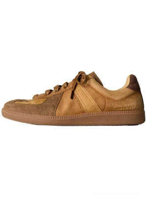 Brown washed suede colorblock retro trainer in left side profile with layered tan panels dark brown heel cap and gum rubber outsole