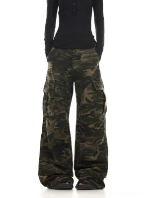 Front view of women’s washed woodland camo wide leg streetwear cargo pants with large utility side pockets