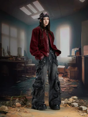 Distressed black wide-leg cargo jeans with oversized flap pockets, industrial utility details, faded denim texture, and gothic streetwear styling shown from the front
