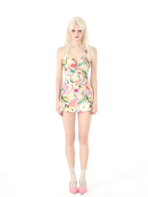 Front view of watercolor blossom halter one-piece swimsuit with twisted plunge neckline and fitted flared swim skirt