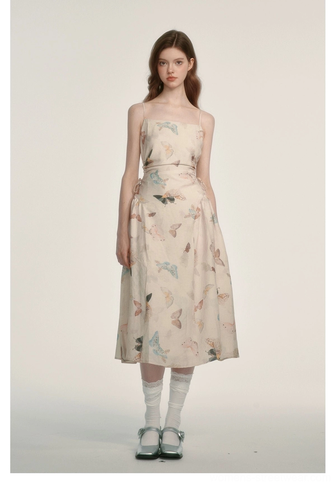Front studio view of a watercolor butterfly print spaghetti strap midi dress with fitted waist and square neckline