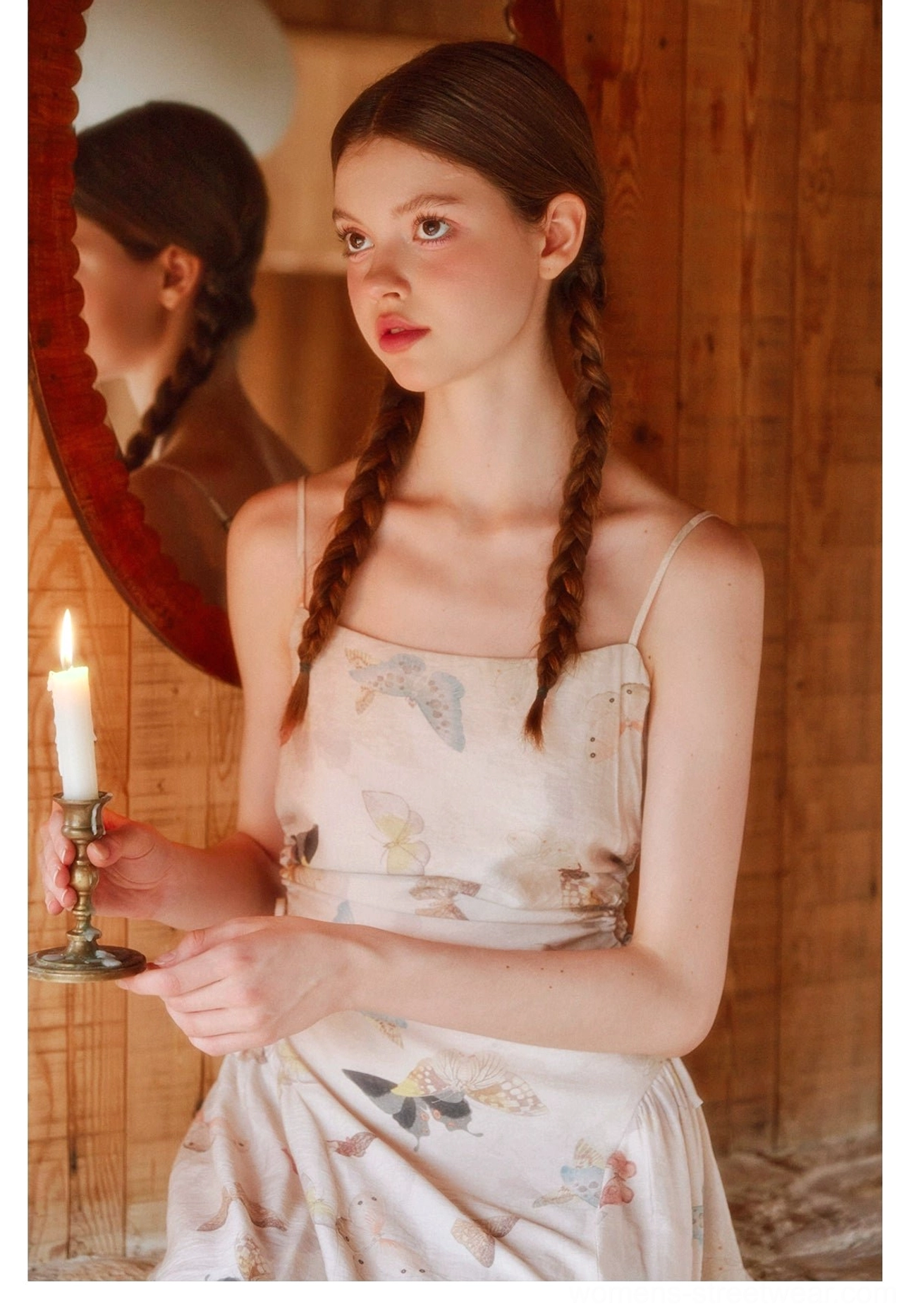 Close-up view of a cream watercolor butterfly print dress with square neckline and thin spaghetti straps