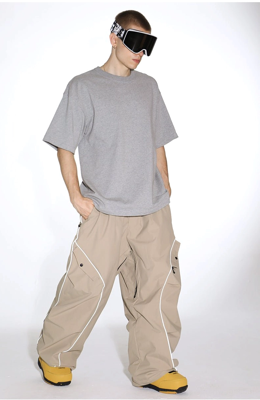 Waterproof baggy snowboard cargo pants with adjustable hems and reflective streetwear piping detail
