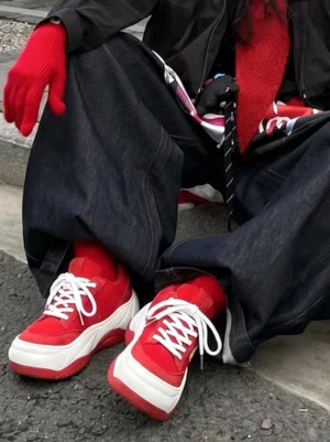 Red white platform sneakers on-foot styling wide-leg jeans red gloves streetwear look