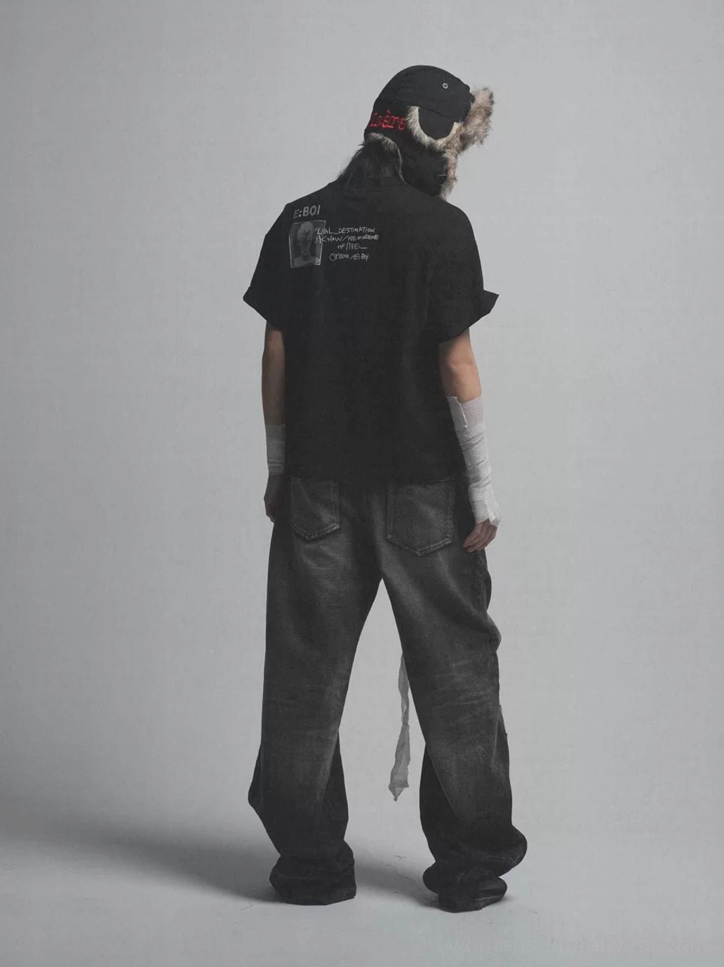 Black oversized Whatever Guitarist tee back view with photocopy portrait graphic and E BOI text