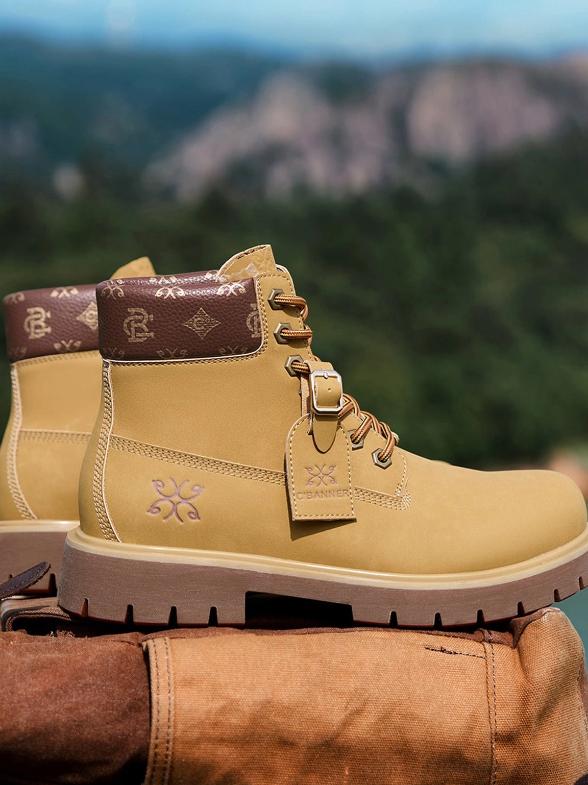 Wheat contrast-stitch lug sole work boots displayed outdoors showing embossed side detail and heavy tread sole