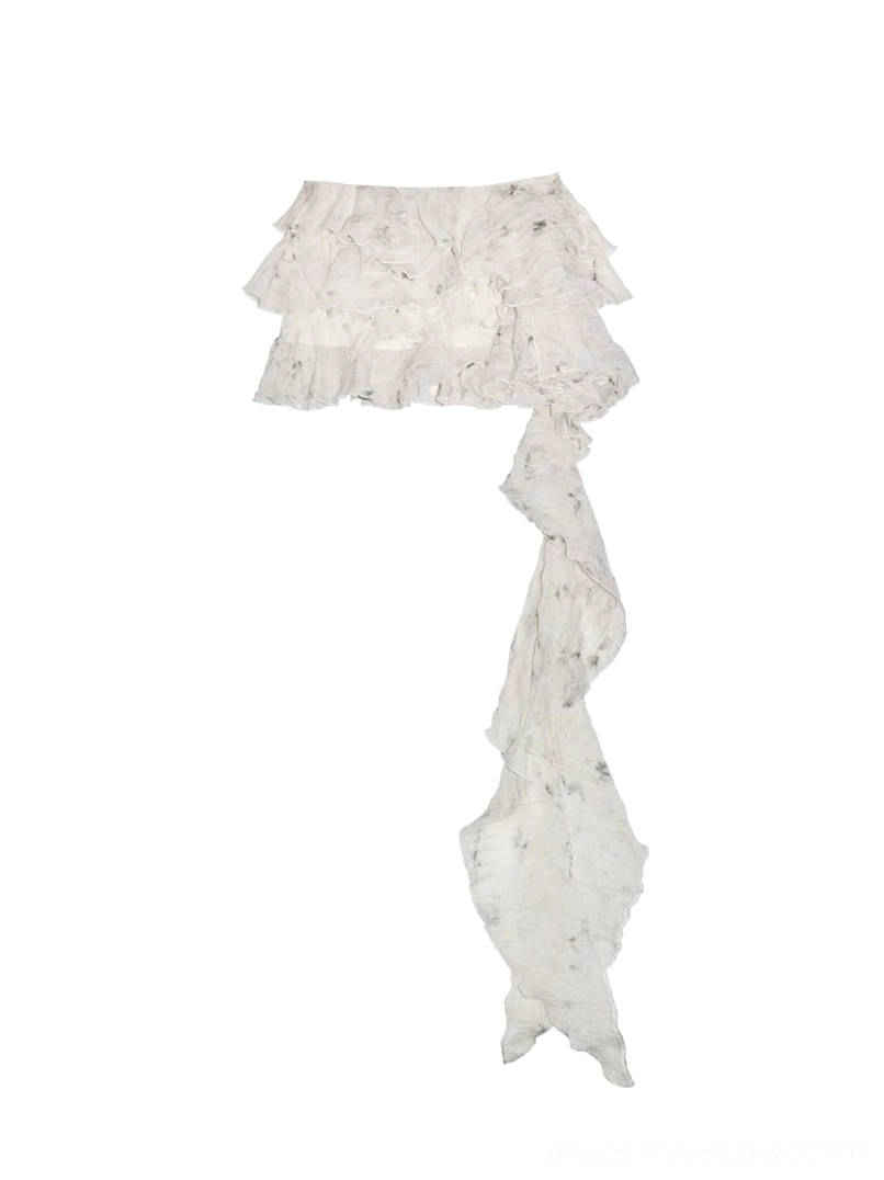 Flat lay view of white asymmetrical tiered lace ruffle mini skirt with layered waist and trailing lace decoration