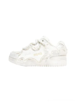 White bat panel platform skate sneaker in left side profile with distressed split leather overlays, tonal laces, embossed side detail, and thick sculpted rubber sole