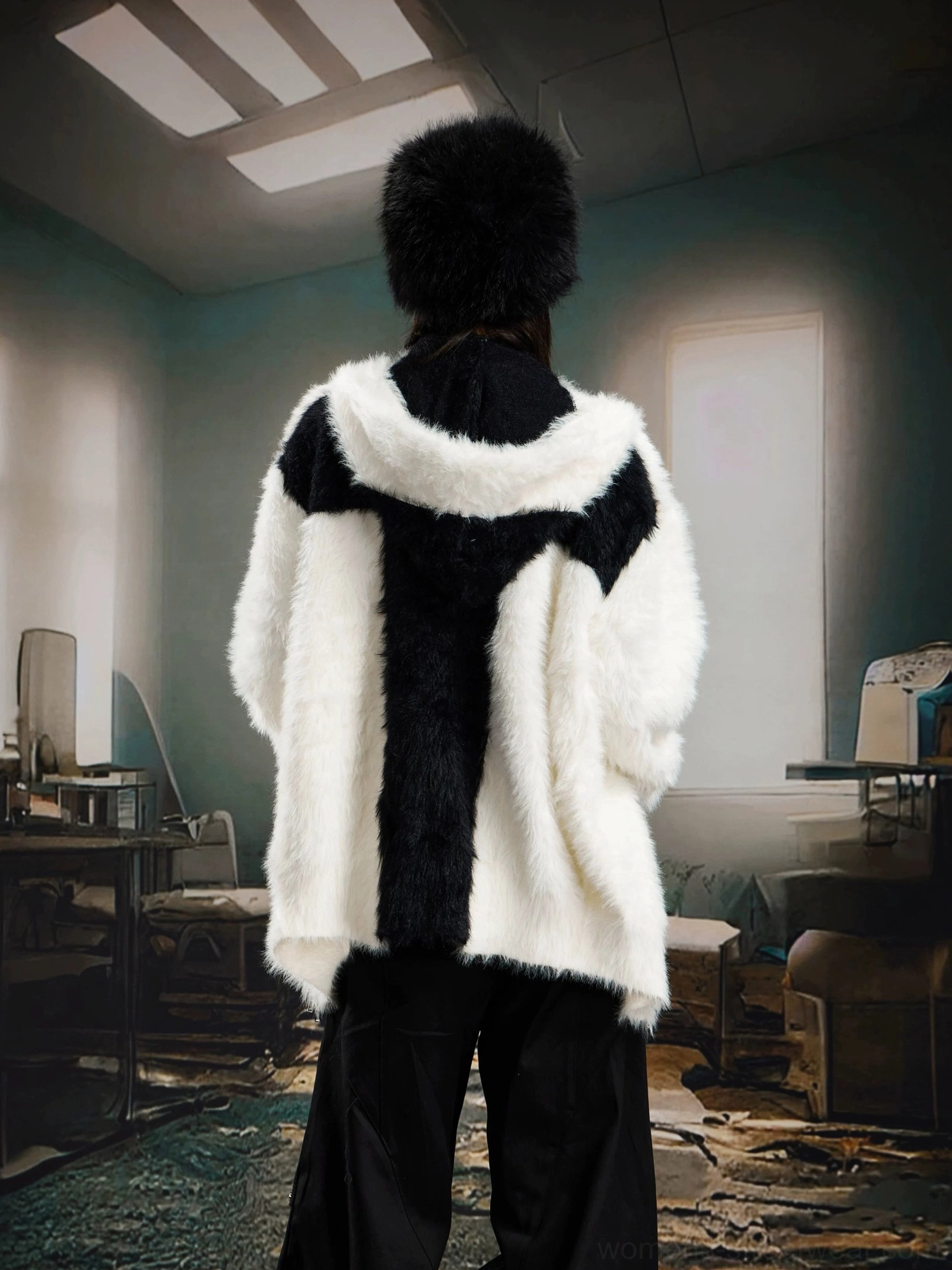 White and black color block faux fur hooded jacket with soft plush texture and streetwear styling