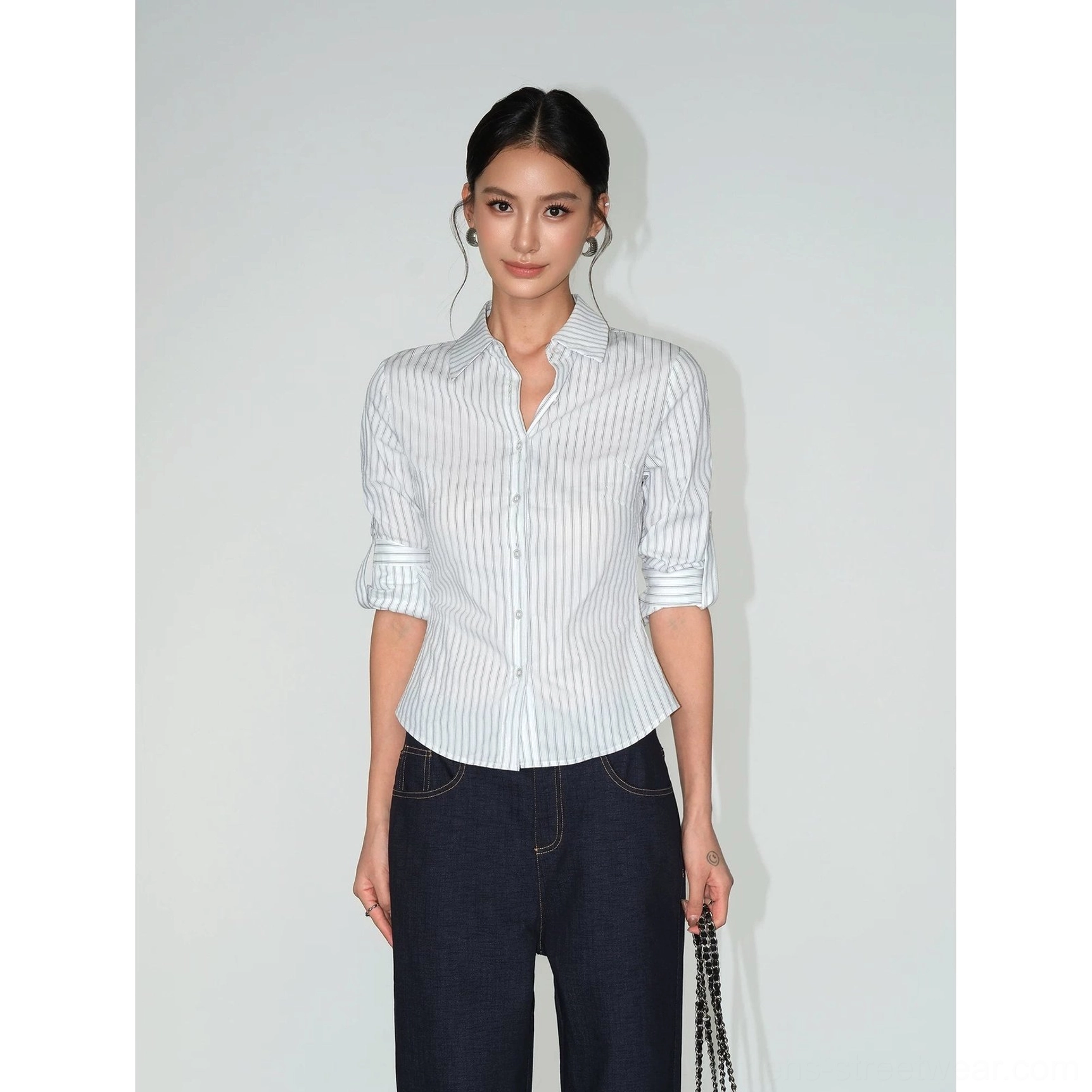 White and black striped women's fitted tailored shirt with vertical pinstripes and modern smart-casual appeal