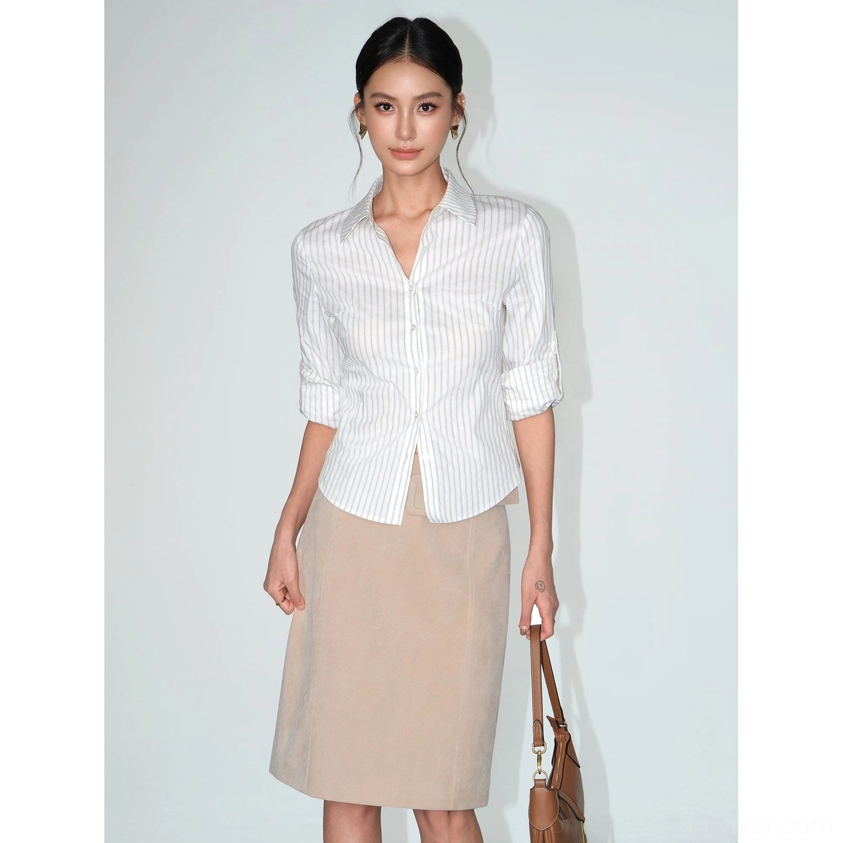 White and brown striped women's fitted shirt with classic button placket and refined neutral streetwear aesthetic