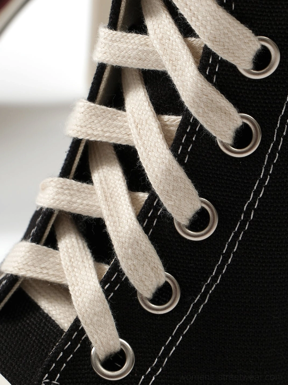 Canvas lace-up stiletto sneaker boots white colorway style side profile showcasing canvas material quality and oversized lace system design detail for streetwear fashion