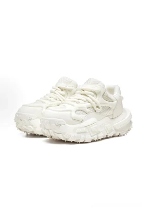Off-white chunky leather-look platform sneakers with breathable mesh panels, lace-up closure, and rugged lug sole shown from a front three-quarter angle