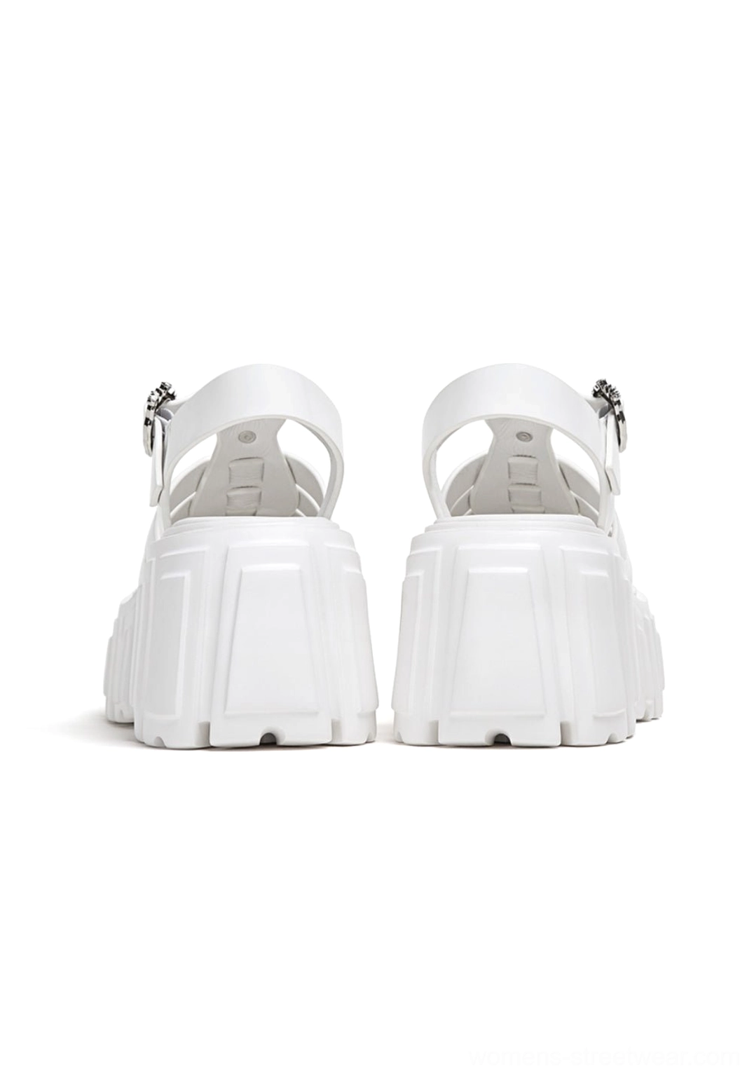 Rear view of white chunky Roman platform sandals showing block heels and adjustable metal ankle buckles