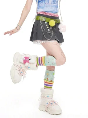 White chunky winter boots worn with rainbow striped socks in a Y2K streetwear outfit, highlighting the plush teddy lining, thick sole, and decorative ankle details