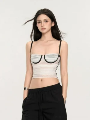 White contrast trim sheer bustier crop cami top front view styled with black loose sweatpants