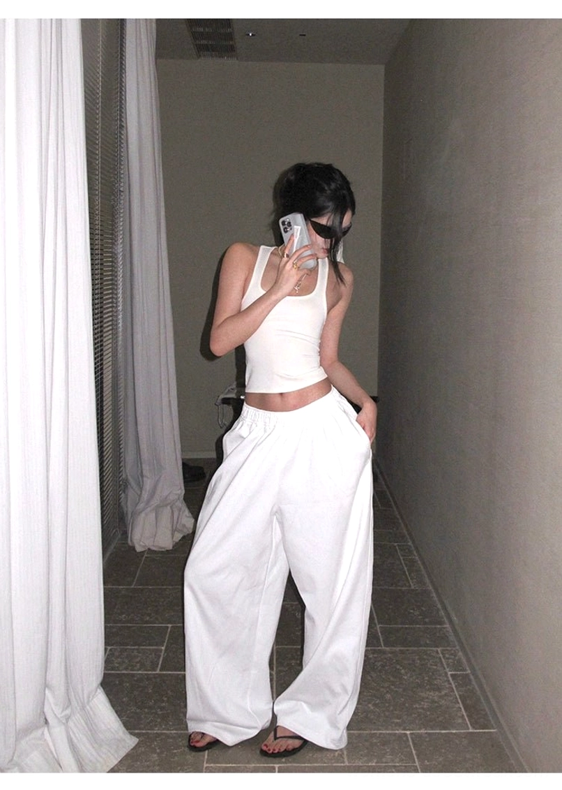 White cotton wide-leg streetwear pants product image showing relaxed volume, elastic waist comfort, and back pocket utility