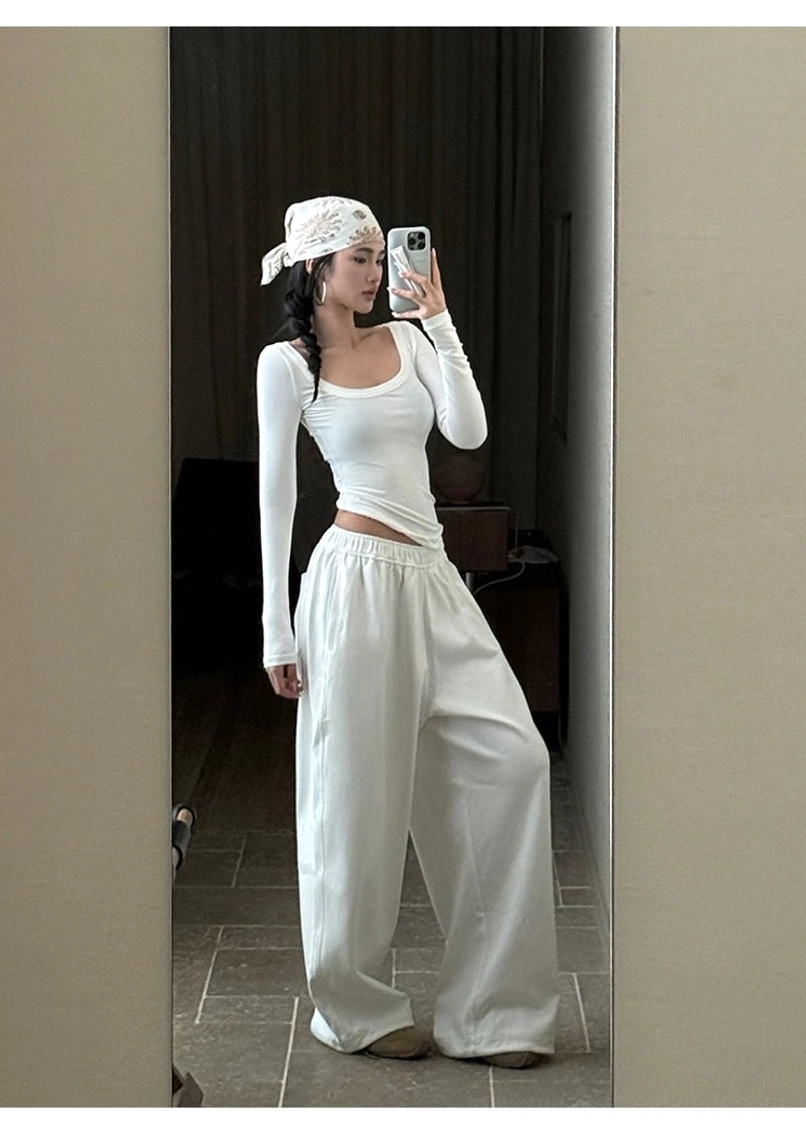 White cotton wide-leg streetwear pants product image designed for minimalist outfits, layered tops, and modern city styling