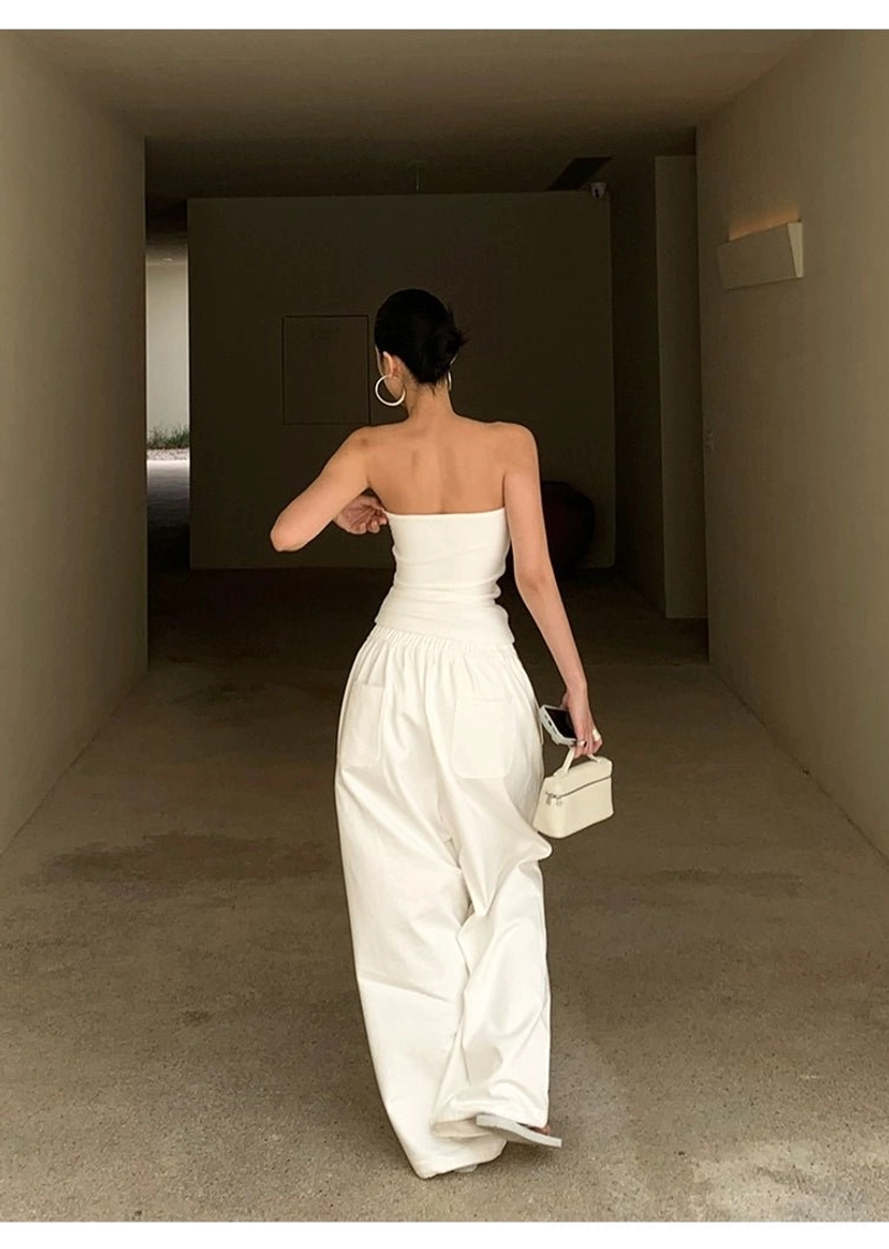 White cotton wide-leg streetwear pants product image showing the relaxed draped silhouette and minimalist solid white finish