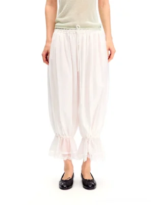 White cropped balloon streetwear pants with adjustable drawstring waist and ruffled lace hem detail
