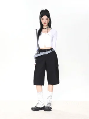 White cropped square neck button-up long sleeve streetwear top styled with black cargo shorts, silver socks, and black shoes