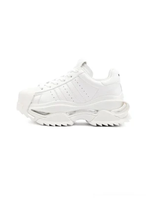 White cutout-sole platform sneaker shown in a clean side view with layered panels, rounded shell toe, tonal side stripes, and thick sculptural outsole