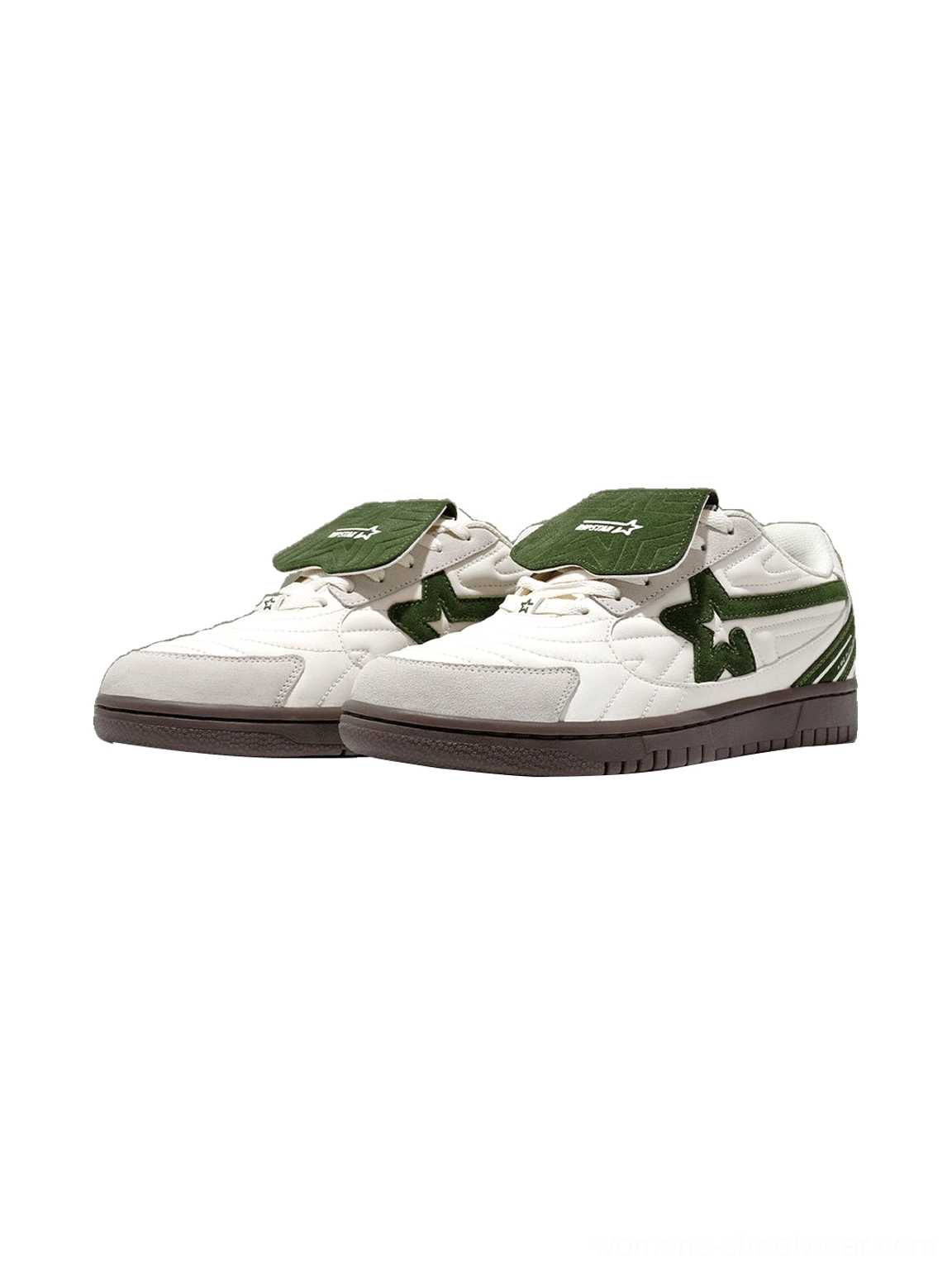 Pair of white and dark green detachable tongue casual sneakers displayed from a three quarter side angle with star detailing