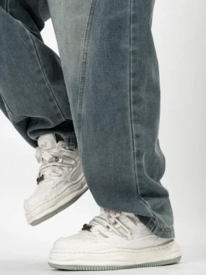 Rear three-quarter view of white distressed skate-inspired platform sneakers showing the worn-in upper, dissolving-style thick midsole and casual streetwear silhouette