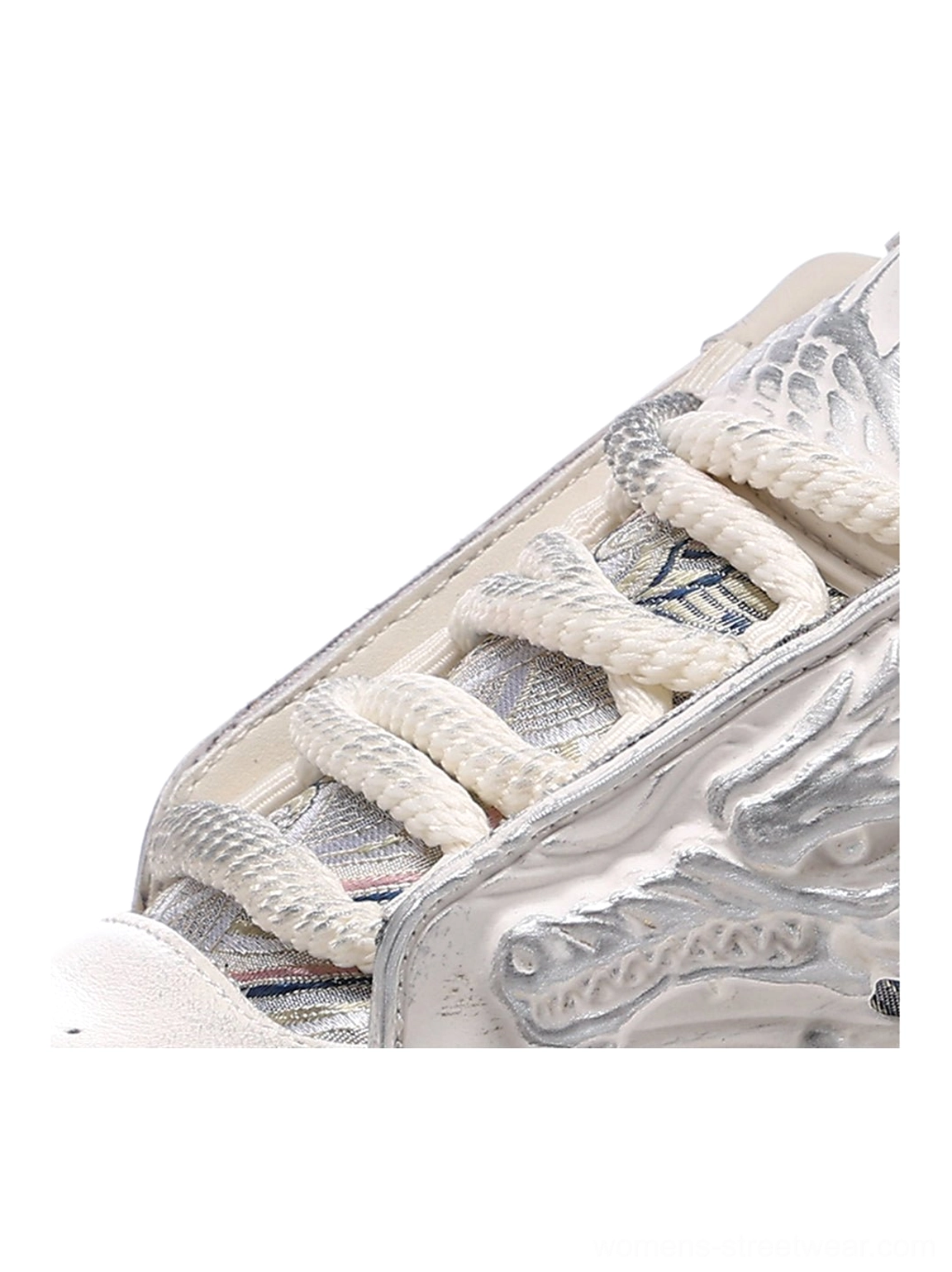 White dragon platform sneakers featuring carved relief panels, lace-up styling, and a bold Y2K chunky silhouette
