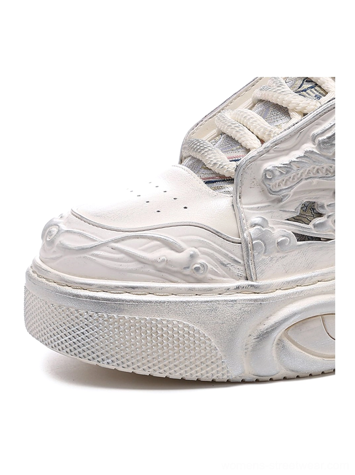 White dragon relief streetwear sneakers with a monochrome upper and exaggerated wavy platform sole