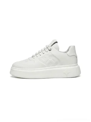White embossed monogram chunky platform sneaker shown in a side three-quarter view with a thick sculpted sole and clean all-white synthetic leather upper
