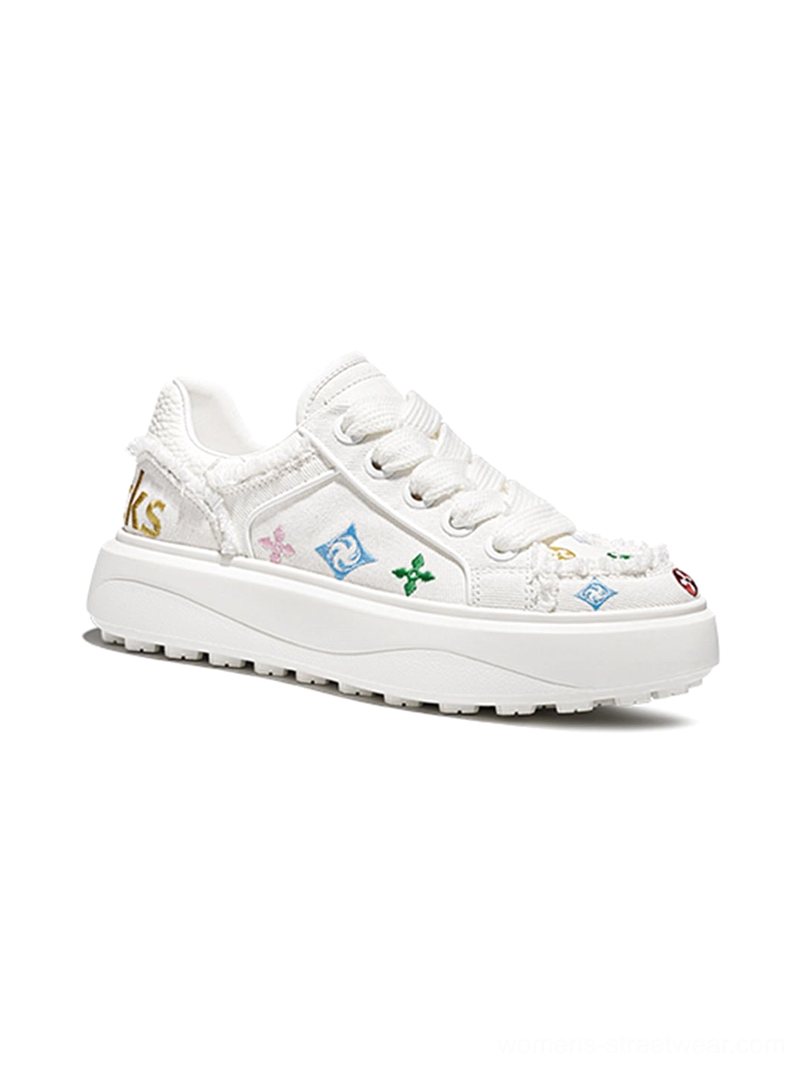 Three-quarter front view of white embossed platform skate sneakers with colorful motifs textured panels and chunky outsole