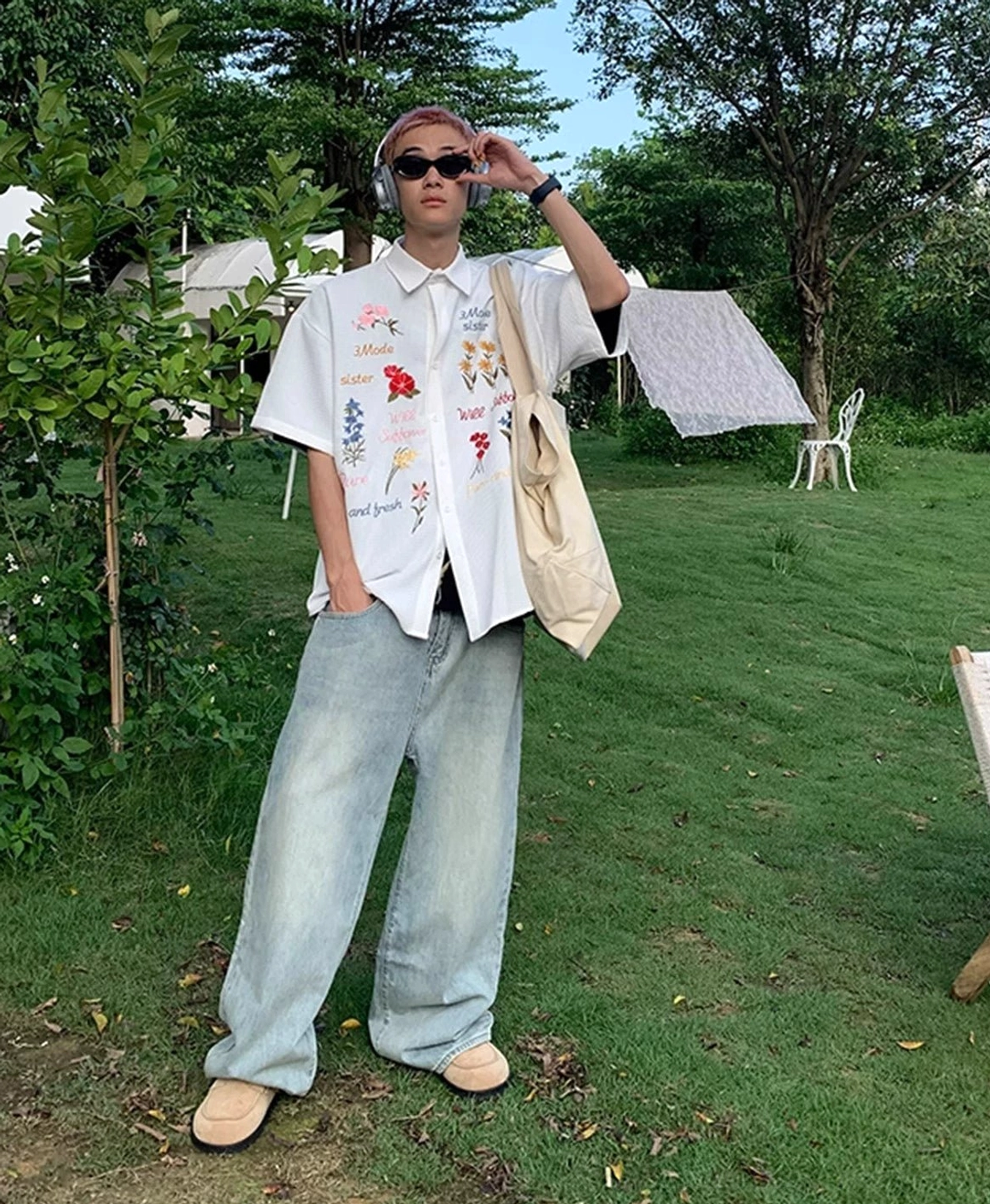 White embroidered floral waffle shirt with colorful flowers and text details styled as a clean Korean summer streetwear outfit