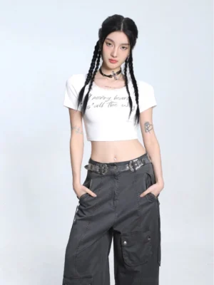 White fitted lace trim cropped baby tee with U-neck and letter graphic styled in a Seoul inspired streetwear outfit front view