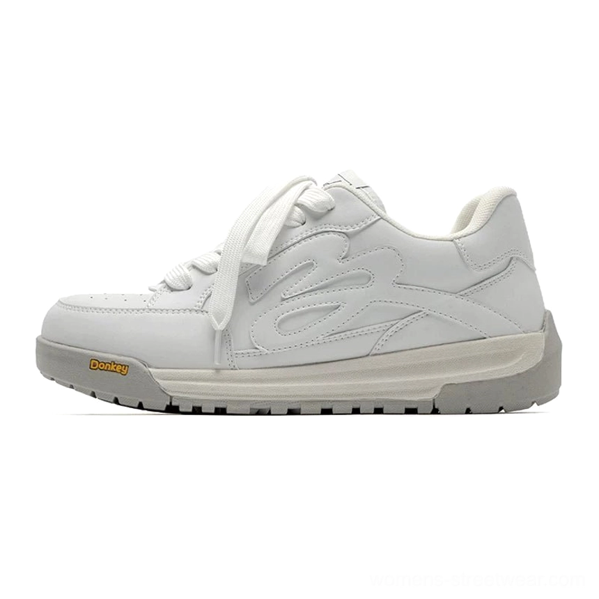 White low-top platform skate sneakers with smooth synthetic leather upper, flame embossed side detail, chunky rubber outsole, and clean streetwear silhouette