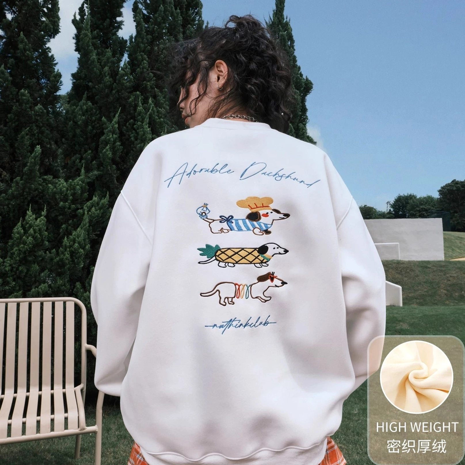 White fleece-lined oversized dachshund graphic sweatshirt for cozy Korean streetwear layering and playful everyday style